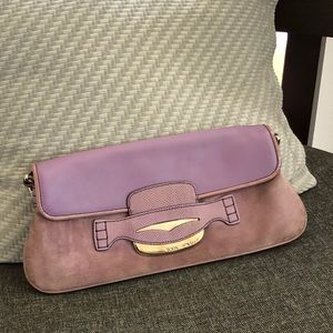 Tod’s leather and suede purple clutch bag